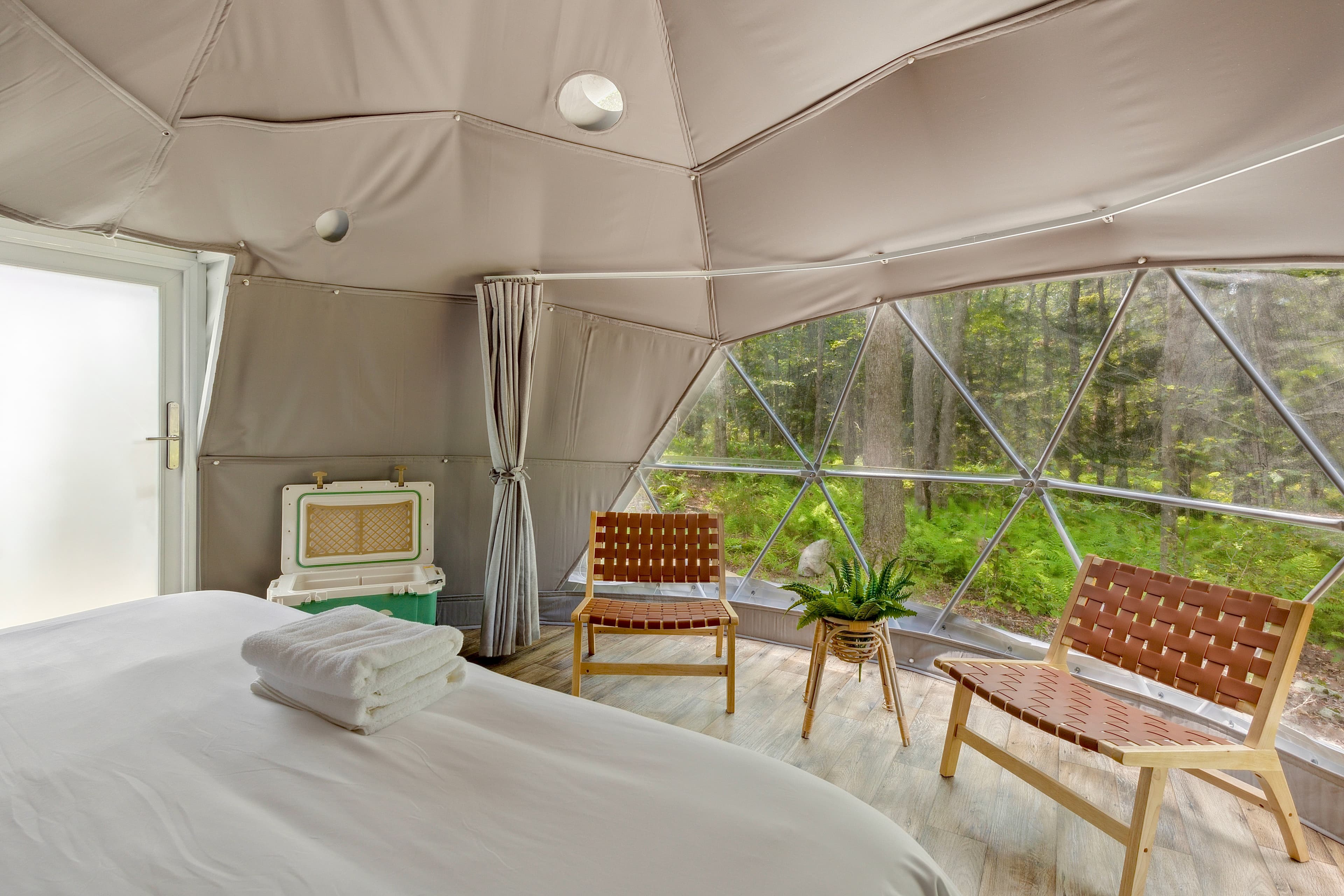 Inside a Ferncrest dome — king bed with plush linens